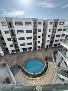 an overhead view of a building with a swimming pool at cozy studio 5 min walk to beash in Agadir
