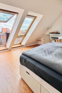 Rúm í herbergi á Das Stader Penthouse mit Dachterrassen