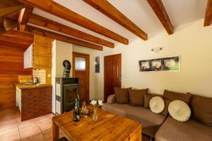 a living room with a couch and a table at Domki Pogorzelica in Pogorzelica