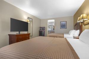 Voodi või voodid majutusasutuse Best Western Inn of Chandler toas