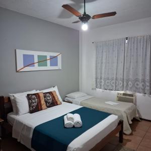 Cama ou camas em um quarto em Pousada 3 Corações Penedo
