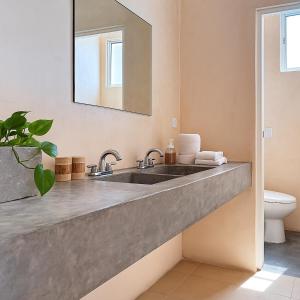 a bathroom with a sink and a mirror at Kassia Tulum in Tulum +42 photos