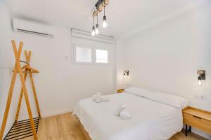 Postel nebo postele na pokoji v ubytování Apartamento acogedor frente a Plaza del Cedro