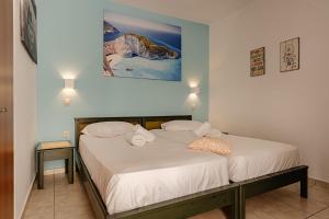 Letto o letti in una camera di Future Appts
