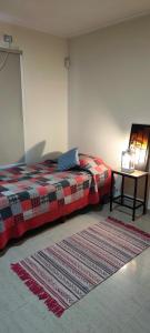 En eller flere senge i et værelse på Espacio Abriendo Caminos