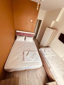 Postel nebo postele na pokoji v ubytování Sera Hotel