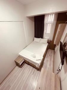 Postel nebo postele na pokoji v ubytování Sera Hotel