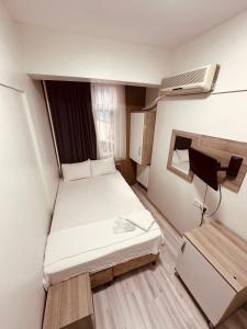 Postel nebo postele na pokoji v ubytování Sera Hotel