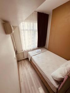 Postel nebo postele na pokoji v ubytování Sera Hotel