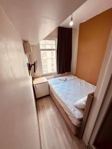 Postel nebo postele na pokoji v ubytování Sera Hotel