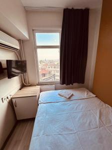 Postel nebo postele na pokoji v ubytování Sera Hotel
