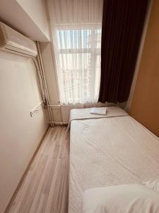 Postel nebo postele na pokoji v ubytování Sera Hotel