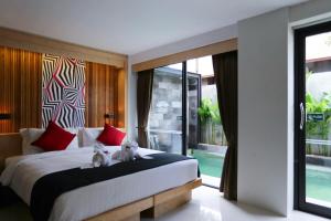 Postel nebo postele na pokoji v ubytování Pavilion Pool Residence Samui - SHA Extra Plus