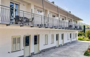 a balcony on the side of a building at 1 Bedroom Lovely Apartment In Ricadi in Ricadi +13 photos