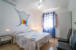 Ένα ή περισσότερα κρεβάτια σε δωμάτιο στο Casa Centro Storico by Cottage sul Mare