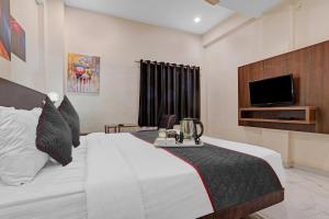 Townhouse Hotel O Benchmark客房内的一张或多张床位