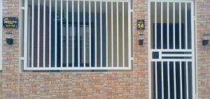 a brick building with a gate on it at Mamsis Cozy Home by RH in Bangad