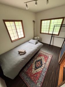 Ένα ή περισσότερα κρεβάτια σε δωμάτιο στο tiny tiny Niseko