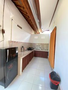 Kuchyň nebo kuchyňský kout v ubytování MALINI Homestay
