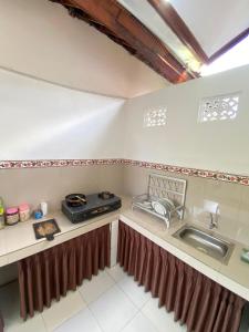 Kuchyň nebo kuchyňský kout v ubytování MALINI Homestay