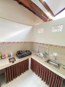 Kuchyň nebo kuchyňský kout v ubytování MALINI Homestay + 37 fotografií