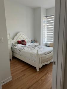 a bedroom with a white bed and a window at Best Choice for Travellers in Toronto +48 photos