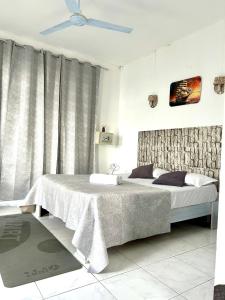 Postel nebo postele na pokoji v ubytování Coco Villa