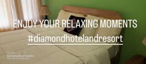 a bed with avertisement for at DIAMOND Hotel and Resort in Dargai +4 photos