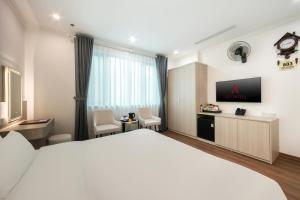 TV a/nebo společenská místnost v ubytování A25 Hotel - Hoàng Đạo Thúy 2 + 14 fotografií
