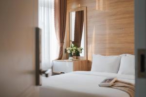 Voodi või voodid majutusasutuse Nature Hotel Da Lat - Le Dai Hanh toas
