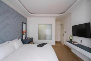 Voodi või voodid majutusasutuse Nature Hotel Da Lat - Le Dai Hanh toas