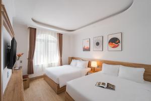Voodi või voodid majutusasutuse Nature Hotel Da Lat - Le Dai Hanh toas +34 fotot