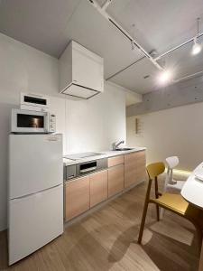 Kuchyň nebo kuchyňský kout v ubytování bHOTEL Art Bldg - Stylish Apartment Very Good Location