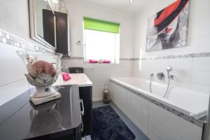 a bathroom with a vase on top of a counter at Appartements Lehenhof in Sankt Johann im Pongau