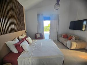 Ένα ή περισσότερα κρεβάτια σε δωμάτιο στο La Terrasse de Saint-Gilles