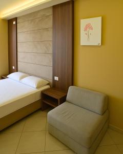 Postel nebo postele na pokoji v ubytování AMMEN Rooms + 26 fotografií