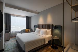 Katil atau katil-katil dalam bilik di Mercure Madiun