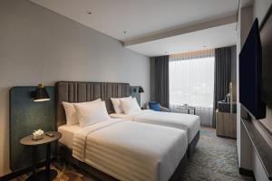 Katil atau katil-katil dalam bilik di Mercure Madiun