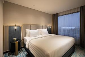 Katil atau katil-katil dalam bilik di Mercure Madiun
