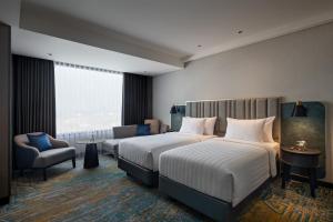 Katil atau katil-katil dalam bilik di Mercure Madiun