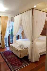 Postel nebo postele na pokoji v ubytování Hotel Pousada Florença