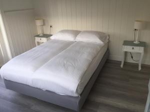 Postel nebo postele na pokoji v ubytování Studio De Laan