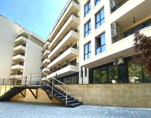 a building with a staircase in front of it at Hotel Rooms St Paul in Plovdiv
