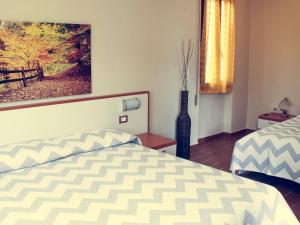 Postel nebo postele na pokoji v ubytování B&B Tina