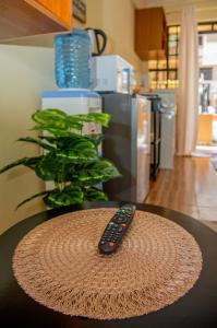 a remote control sitting on top of a table at Stylish Mauve Studio with free WI-FI in Nanyuki