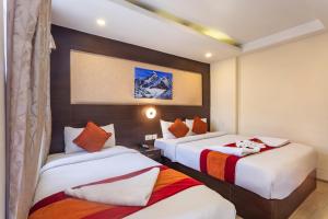 a hotel room with two beds in a room at Hotel Sapana Garden Thamel in Kathmandu