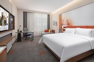 Cama o camas de una habitación en 北京传媒大学希尔顿欢朋酒店Hampton by Hilton Beijing Communication University