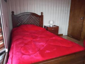 Uma cama ou camas num quarto em Hostal Aurora Coronel