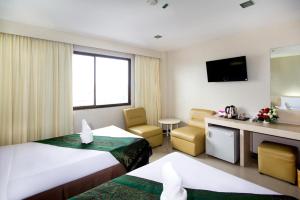 Giường trong phòng chung tại Hatyai Rama Hotel
