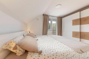 Ένα ή περισσότερα κρεβάτια σε δωμάτιο στο Kurešček